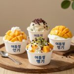 여름철 인기 빙수 4종이 테이블에 놓인 모습으로 망고 옥수수 피스타치오 등 다양한 토핑이 보인다